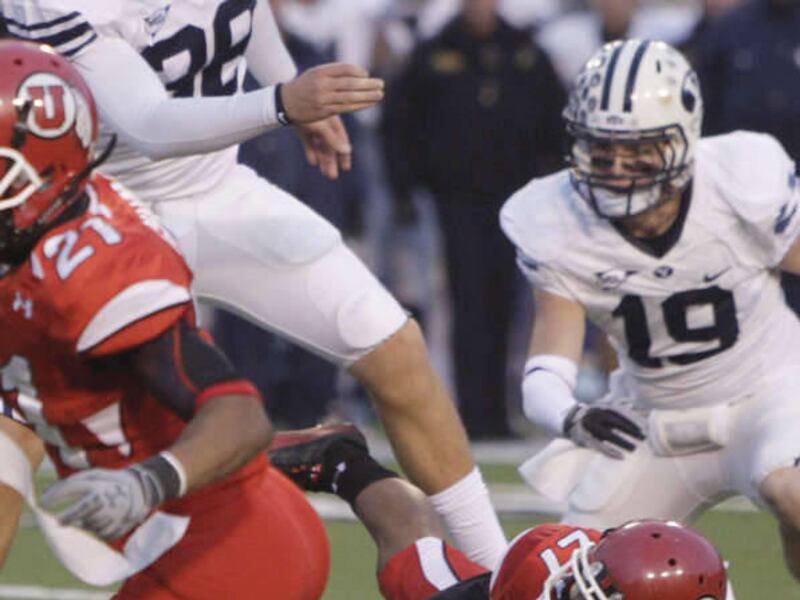 Utah Utes cornerback Brandon Burton (27) blocks the field goal of Brigham Young Cougars kicker Mitch Payne (38) at the end of the game in college football action in Salt Lake City, Utah, Saturday, Nov. 27, 2010. (Jeffrey D. Allred, Deseret News)