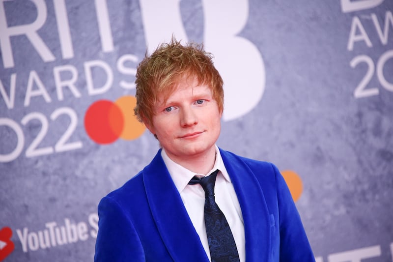 Ed Sheeran poses for photographers upon arrival at the Brit Awards 2022 in London.