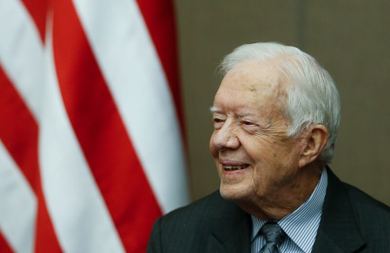 Jimmy Carter smiles as he is awarded the Order of Manuel Amador Guerrero by Panamanian President Juan Carlos Varela during a ceremony at the Carter Center, Jan. 14, 2016, in Atlanta.