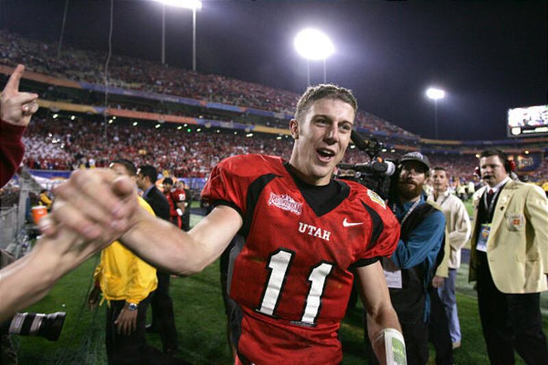 Former Ute Alex Smith slaps hands with fans following Utah's BCS victory in the 2005 Fiesta Bowl.