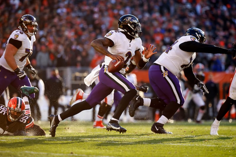 Baltimore Ravens quarterback Tyler Huntley (2) runs with the ball during an NFL football game against the Cleveland Browns.