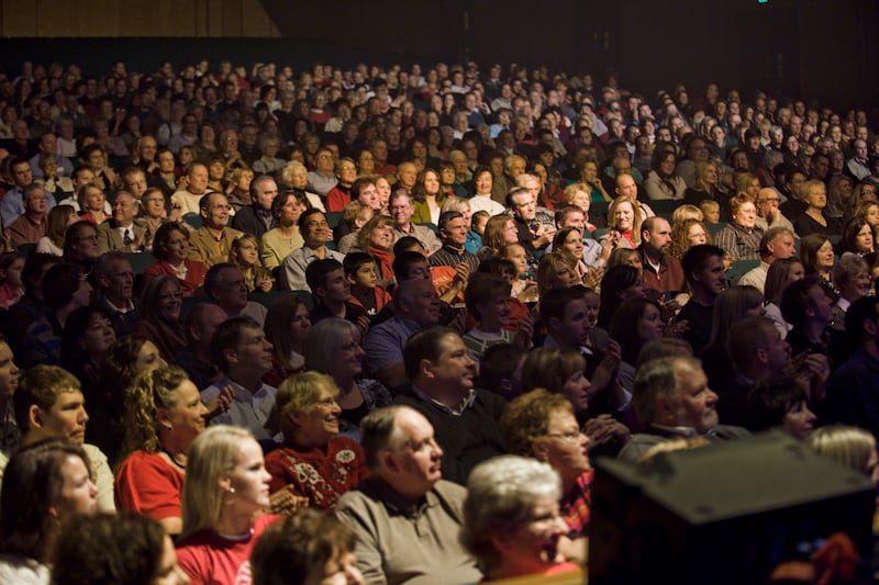 A packed audience listens to a Kurt Bestor Christmas concert.
