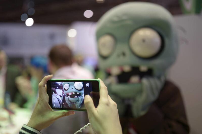 A man takes a picture with Nokia Lumia 1520 at the Mobile World Congress, the world's largest mobile phone trade show in Barcelona, Spain, Tuesday, Feb. 25, 2014.