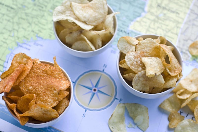 In this image taken on July 30, 2012, from left, Poore Brother’s Habanero, Route 11 Chips Chesapeake Crab, and Boulder Canyons Red Wine Vinegar, potato chips are shown in Concord, N.H.