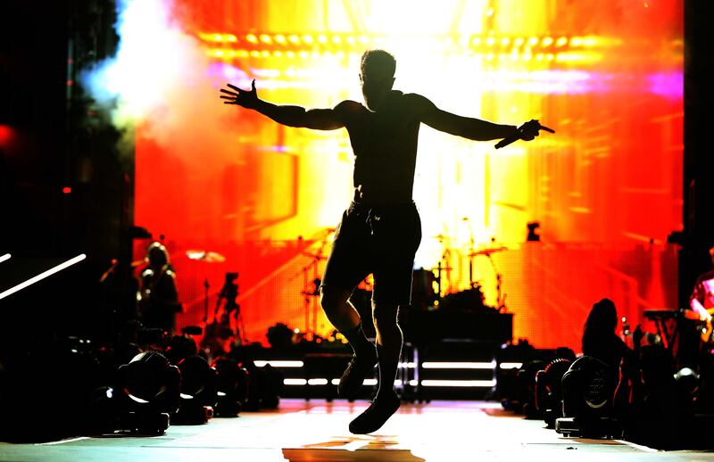 Imagine Dragons' Dan Reynolds performs during the Love Loud music festival in Salt Lake City on Saturday, July 28, 2018. Reynolds recently opened up about his hidden disease, ankylosing spondylitis