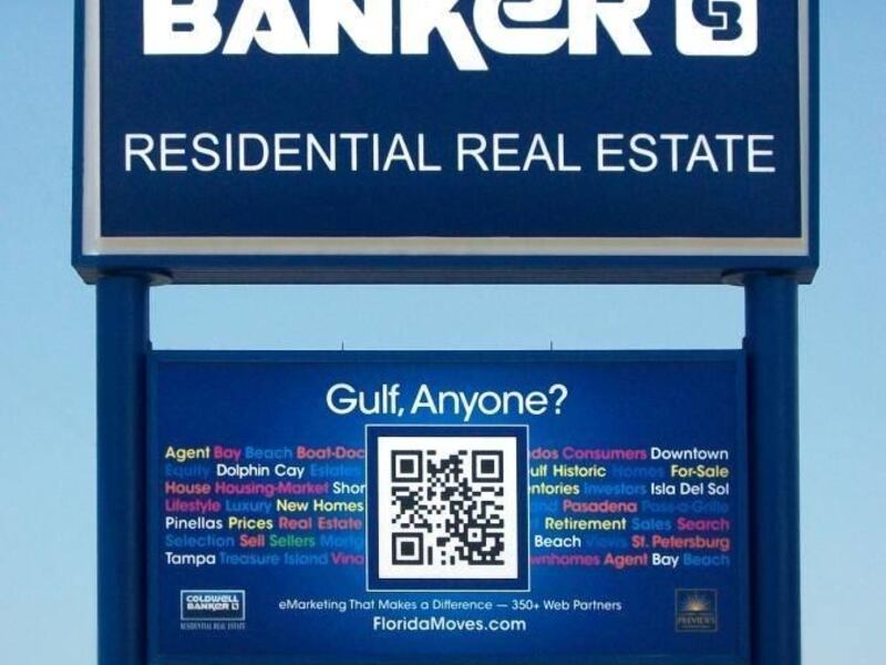 In this undated photo provided by Coldwell Banker, a real estate sign located in St. Petersburg, Fla., using a Quick Response code, the small square with black dots and lines in the bottom half of the image. Anyone walking or driving by can use a smart ph