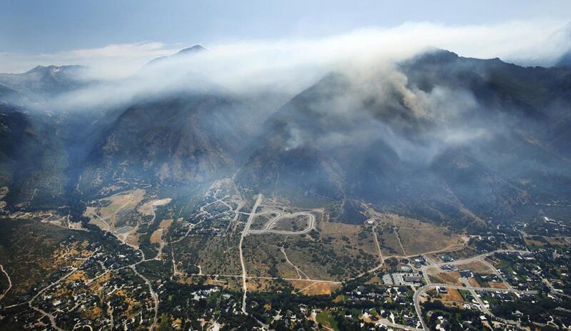 FILE"” Fire crews work on the Water Tower Fire near Alpine on Sunday, July 16, 2017.