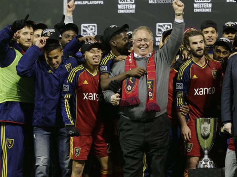 Real Salt Lake owner Dell Loy Hansen, center, celebrates with players after Real Salt Lake's beat the Portland Timbers for the Western Conference championship in the MLS Cup soccer playoffs, Sunday, Nov. 24, 2013, in Portland, Ore. (AP Photo/Ted S. Warren