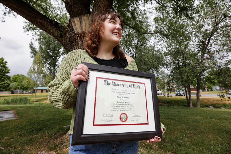 Anna Merrill, a recent college graduate poses for a portrait at Fitts Park in Salt Lake City.