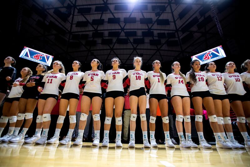 University of Utah women's volleyball team stand arm in arm for a moment of silence for fellow Utah student athlete Lauren McCluskey as the Utes prepare to play Washington State in the Huntsman Center in Salt Lake City on Wednesday, Oct. 24, 2018.