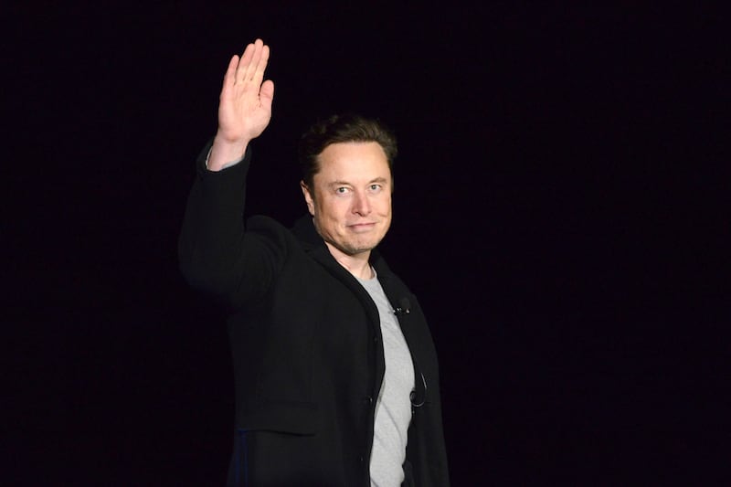 SpaceX’s Elon Musk waves while providing an update on Starship on Feb. 10, 2022, near Brownsville, Texas.
