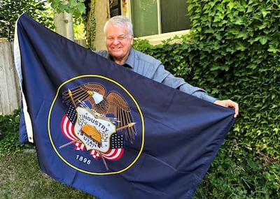 Utah's preeminent vexillologist John Hartvigsen displays the Utah state flag, of which he is a big fan.