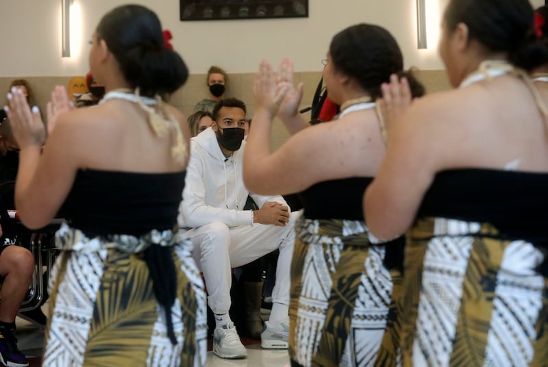 Rudy Gobert, Utah Jazz center and founder of Rudy’s Kids Foundation, center, watches the Northwest Multicultural Dancers perform a Fijian dance at a ribbon-cutting ceremony for the new emergency food pantry at Northwest Middle School in Salt Lake City on Thursday, Oct. 14, 2021.