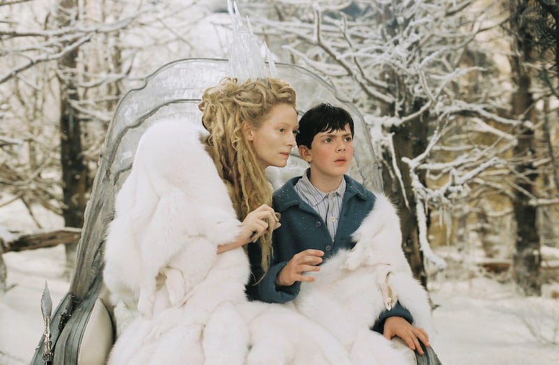 The White Witch (Tilda Swinton) uses enchanted Turkish Delight to convince Edmund (Skander Keynes) in “The Chronicles of Narnia: The Lion, The Witch and The Wardrobe.”