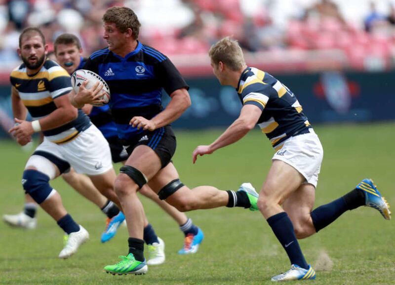 BYU's Kyle Sumsion runs with the ball during the Varsity Cup rugby championship at the Rio Tinto Stadium in Sandy on Saturday, May 3, 2014. BYU won 43-33.