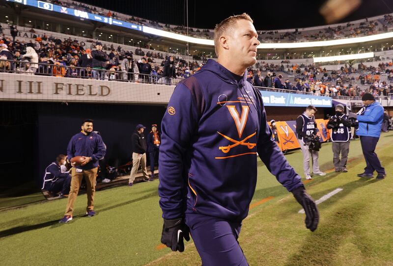 Virginia Cavaliers coach Bronco Mendenhall walks onto the field prior to a game with Notre Dame.