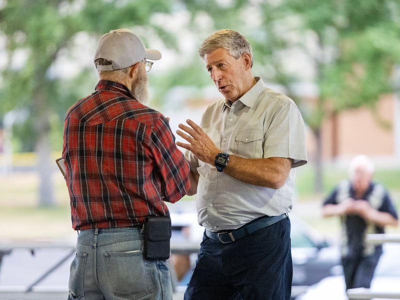 Utah 2nd Congressional District candidate Bruce Hough talks with Ron Mortensen at Bountiful Park on July 19, 2023.