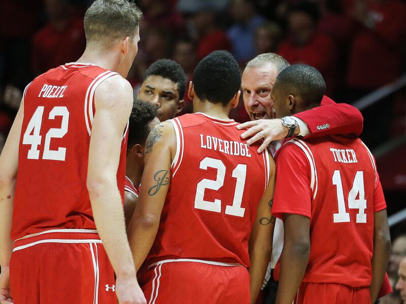 Utah Utes head coach Larry Krystkowiak gathers his players on the court as Utah and BYU play in the Huntsman Center in Salt Lake City Wednesday, Dec. 2, 2015. Utah won 83-75.