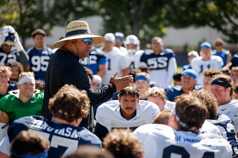BYU coach Kalani Sitake talks to his players during practice Aug. 19. 2025, in Provo. The Cougars open their 2025 season Saturday night at LaVell Edwards Stadium against Portland State.