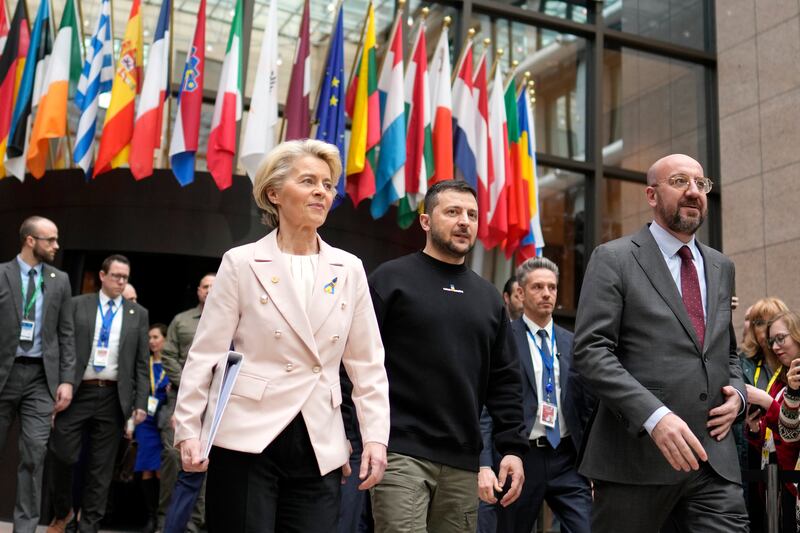 European Commission President Ursula von der Leyen, Ukraine’s President Volodymyr Zelenskyy and European Council President Charles Michel walk together during an EU summit in Brussels.