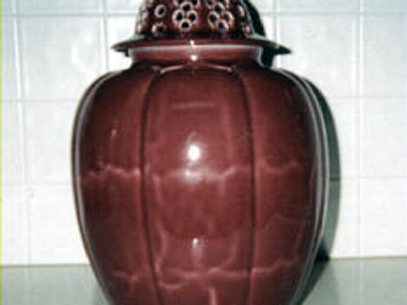 This Rookwood pottery jar is highly collectible but has some problems.