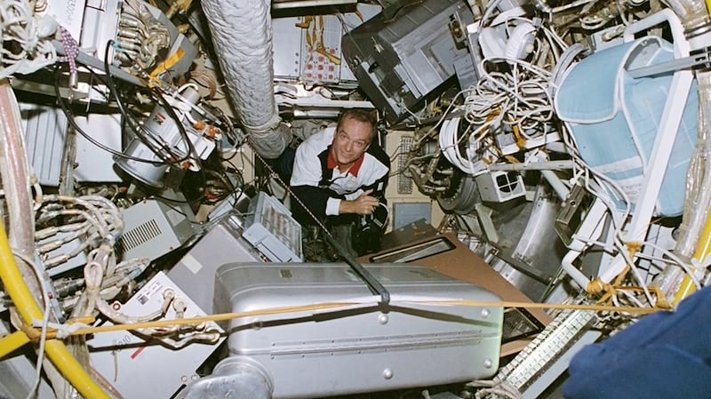Astronaut Charlie Precourt, right, is pictured on one of his four space shuttle missions in the 1990s.