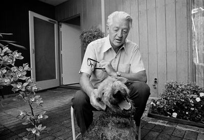 FILE - Author and retired Stanford University professor Wallace Stegner is shown with his dog, Suzie, at his home in Los Altos Hills, Calif., May 2, 1972. Stegner, who sought to capture places in his writing that spanned the entire American West, died 25