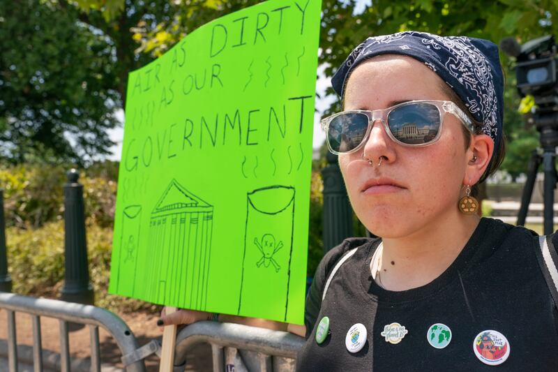A protester against the Supreme Court’s EPA decision is pictured in Washington.
