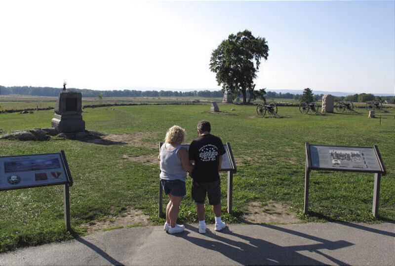 Tourists Sandy and Brian Augustine of East Freedom, Pa., visit Gettysburg National Military Park on Monday.