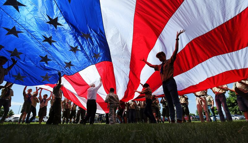 Scouts and Cub Scouts support a 50-foot American flag as American Fork dedicates an addition to its cemetery in 2016.