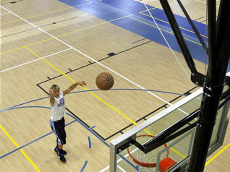 Brandon Houghton of Lindon shoots some hoops at the new Pleasant Grove Community Center, which opened on Tuesday.