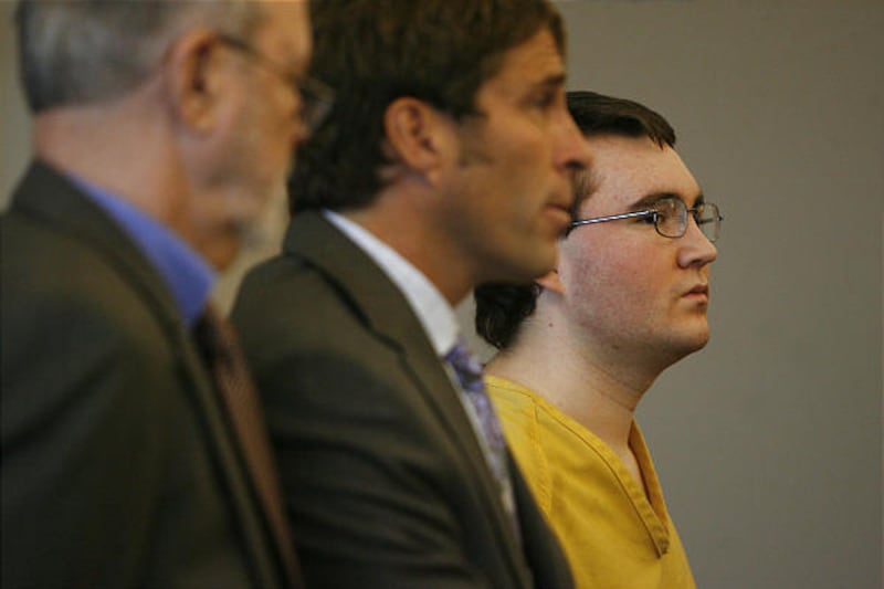 Attorneys Loni Deland, left, and Scott Williams stand with client Christopher Allen Hewitt, right, in 3rd District Court Thursday. Hewitt beat Benjamin Perkins-Link to death in Neff's Canyon in August 2007.
