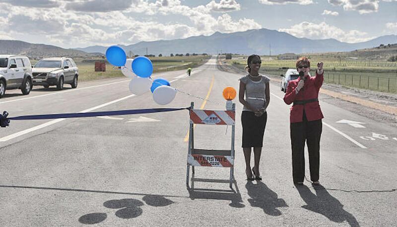Saratoga Springs Mayor Mia Love, left, and Eagle Mountain Mayor Heather Jackson talk before a ribbon cutting Tuesday to officially open a stretch of Pony Express Parkway.