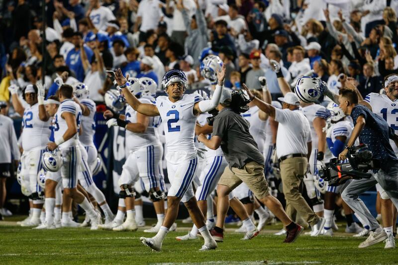 BYU players celebrate after defeating Arizona State at LaVell Edwards Stadium in Provo on Saturday, Sept. 18, 2021.