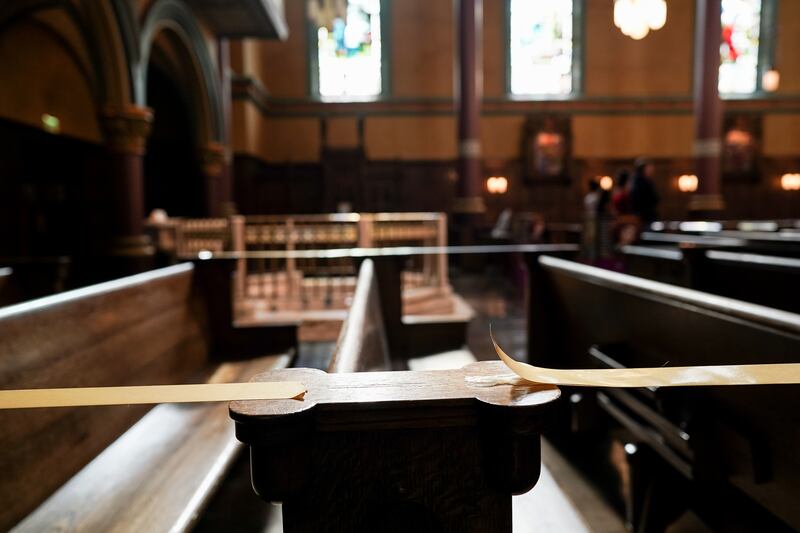 Some pews are taped off to preserve social distancing at the Cathedral of the Madeleine on Tuesday, May 12, 2020.