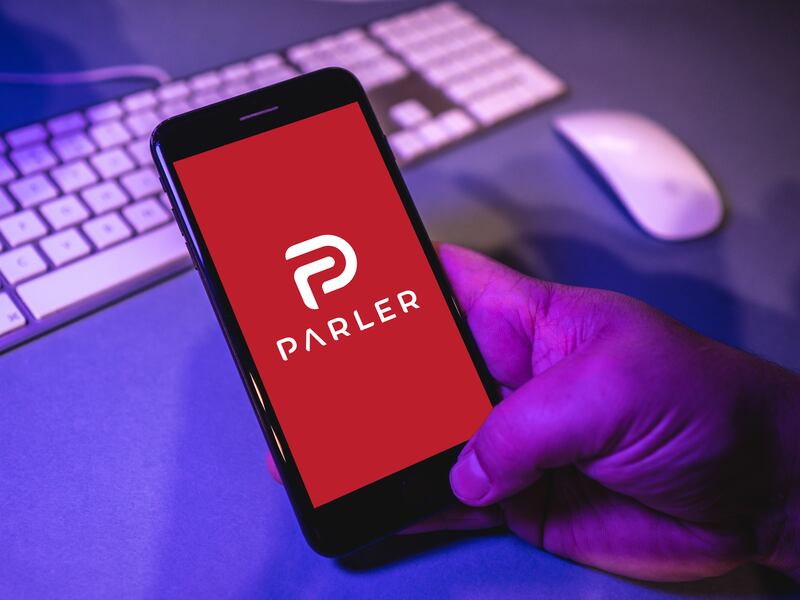 The Parler app pictured on a phone screen. The social platform is teasing a return next month.
