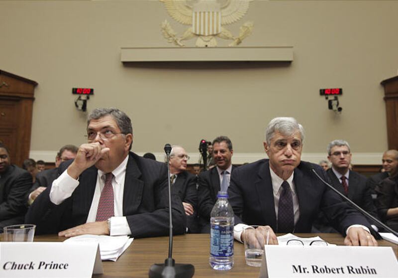 Former Treasury Secretary Robert Rubin, who was a senior adviser and chairman of Citigroup during the mortgage and financial crises, right, and former Citi Chief Executive Officer Charles Prince, prepare to testify on Capitol Hill in Washington, April 8,