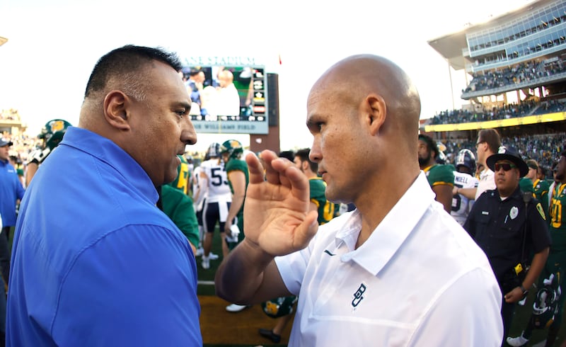 BYU head coach Kalani Sitake shakes hands with Baylor head coach Dave Aranda