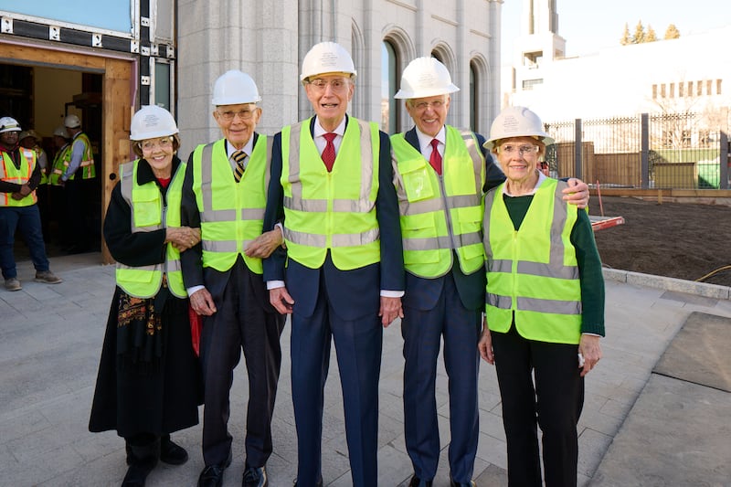 Members of the First Presidency and their wives smile after touring the Salt Lake Temple amid ongoing construction on Friday, Dec. 12, 2025.