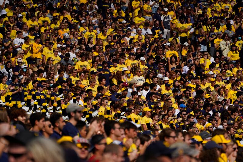 University of Michigan students watch the first half of an NCAA college football game in Ann Arbor, Michigan.