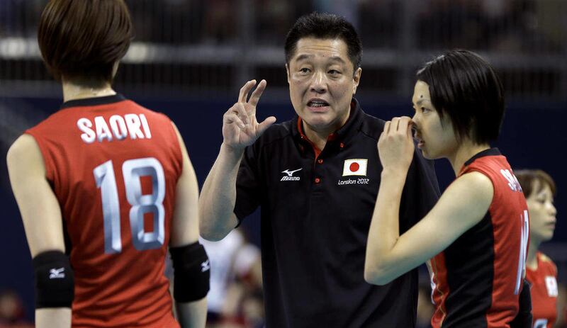 Japan's coach Masayoshi Manabe, center, talks to Saori Kimura (18) and Saori Sakoda (14) during a women's volleyball bronze medal match against South Korea at the 2012 Summer Olympics Saturday, Aug. 11, 2012, in London.