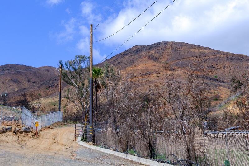 A hill above El Cariso, California, stripped clear of vegetation by the Airport Fire of September 2024 has contributed to flooding.