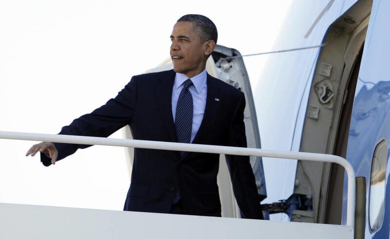 President Barack Obama boards Air Force One, Friday, April 13, 2012, at Andrews Air Force Base, Md., en route to Florida.