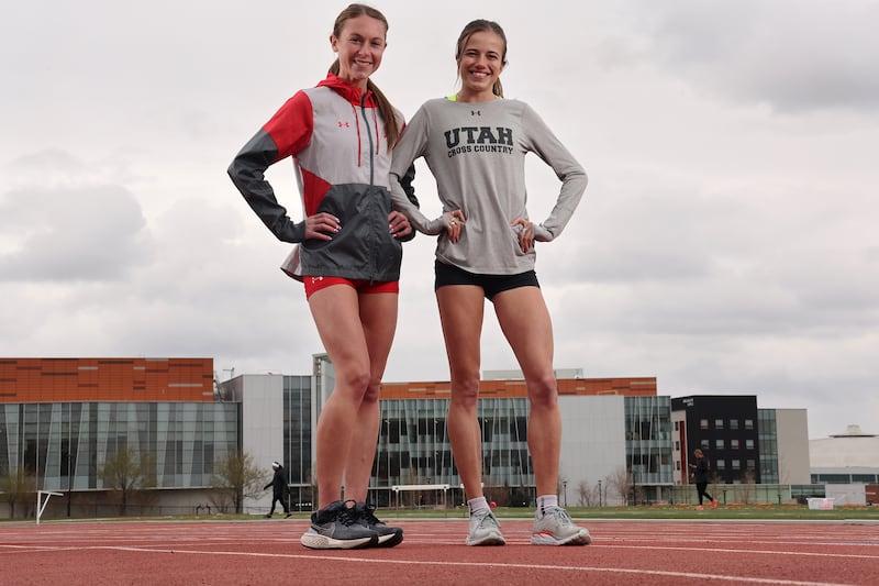 Utah’s Emily Venters and Simone Plourde pose for photos at the University of Utah track in Salt Lake City, April 25, 2023.