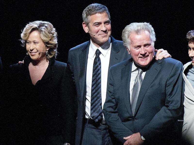From left to right, actress Yeardley Smith, actor George Clooney, and actor Martin Sheen take a bow during the curtain call at the Los Angeles premiere of the play "8" in Los Angeles on Saturday, March 3, 2012.