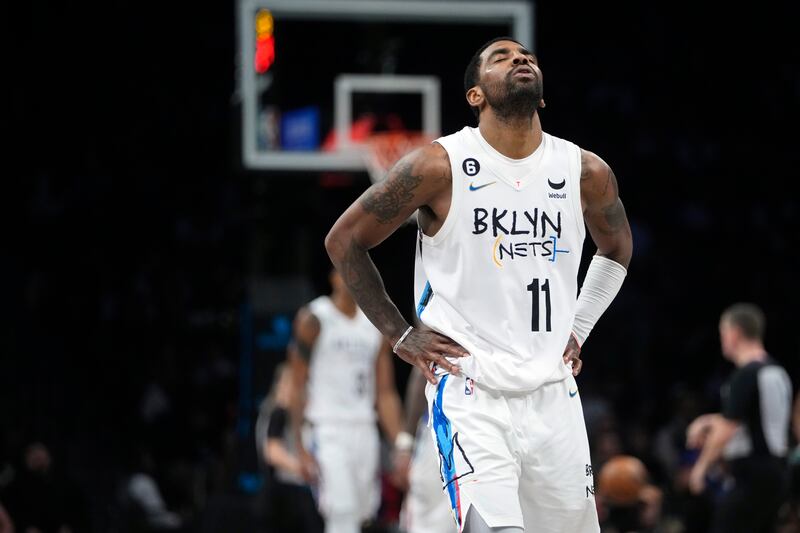 Kyrie Irving reacts during a game between the Brooklyn Nets and Detroit Pistons Thursday, Jan. 26, 2023.