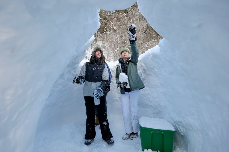Kathryn Watkins and Annabella Schweitz build an igloo in Big Cottonwood Canyon.