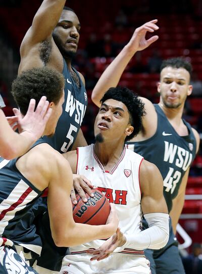 Utah guard Sedrick Barefield is tied up by Washington State players on his way to the basket at the Huntsman Center in Salt Lake City on Sunday, Jan. 21, 2018. Barefield, who tested the NBA draft waters this summer, will be among the leaders returning to