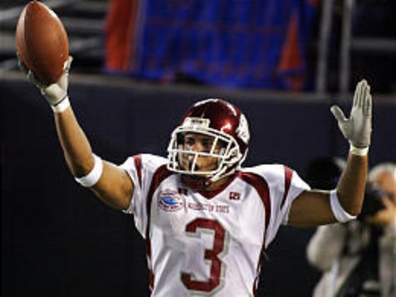 Washington State's Sammy Moore celebrates his second touchdown against Texas in Holiday Bowl.