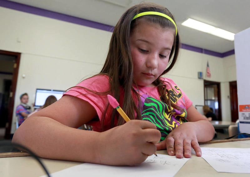 Adriana Gonzalez takes a practice SAGE test at Polk Elementary School in Ogden on Thursday, April 17, 2014.